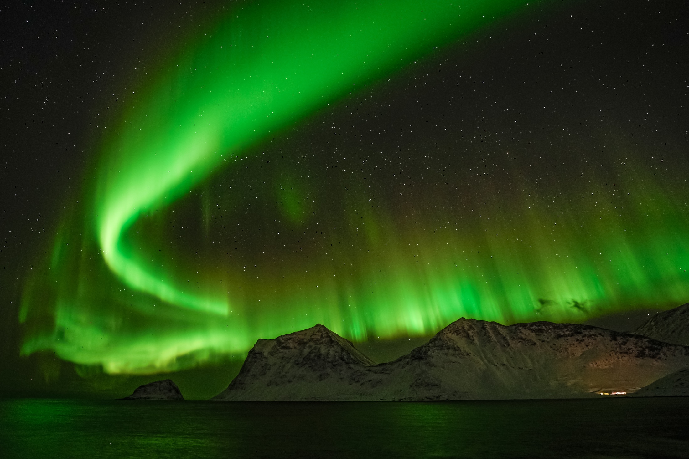 Northern lights over an Arctic landscape